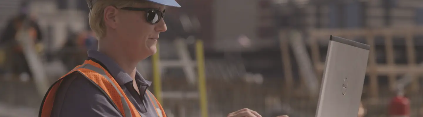 woman on jobsite with laptop