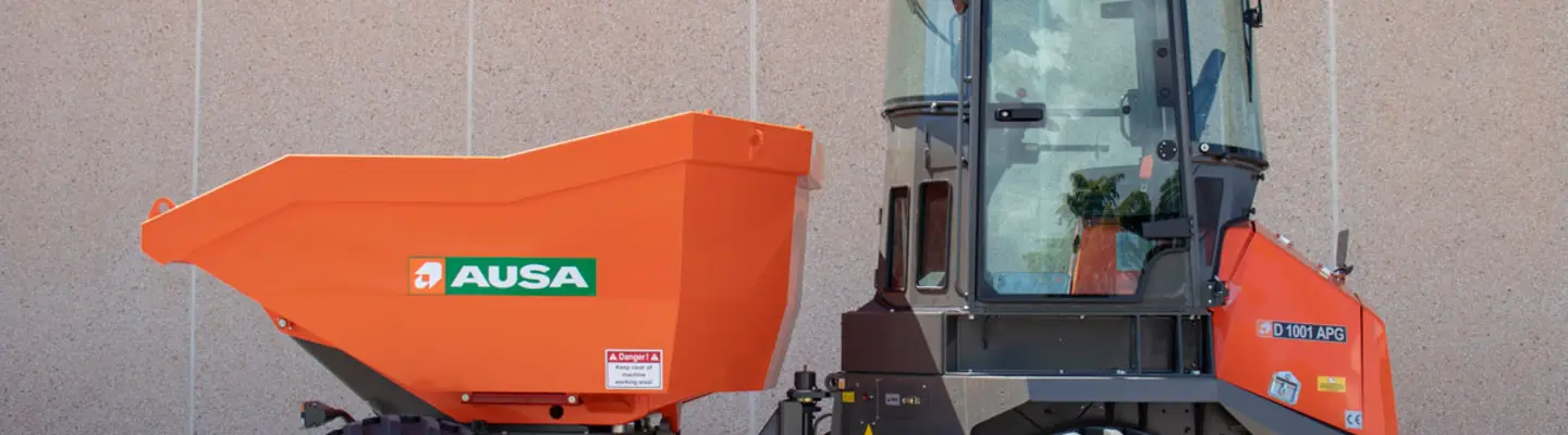 A dumper vehicle operating on a construction worksite, transporting materials to support ongoing building activities.