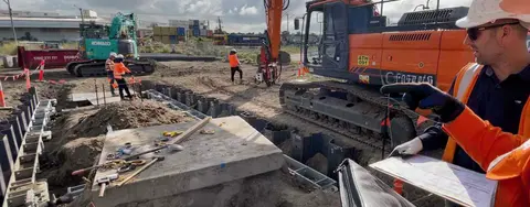 Engineer inspecting shoring installation onsite 