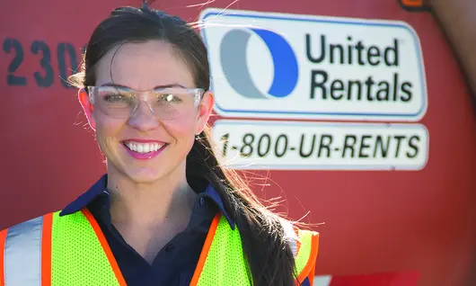girl in ppe next to equipment