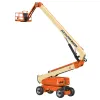 Side angled view of an orange and beige JLG boom lift, extended vertically with basket.