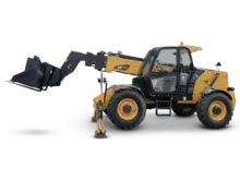 Yellow telehandler parked on a construction site, ready to lift and move heavy materials with its extendable boom.